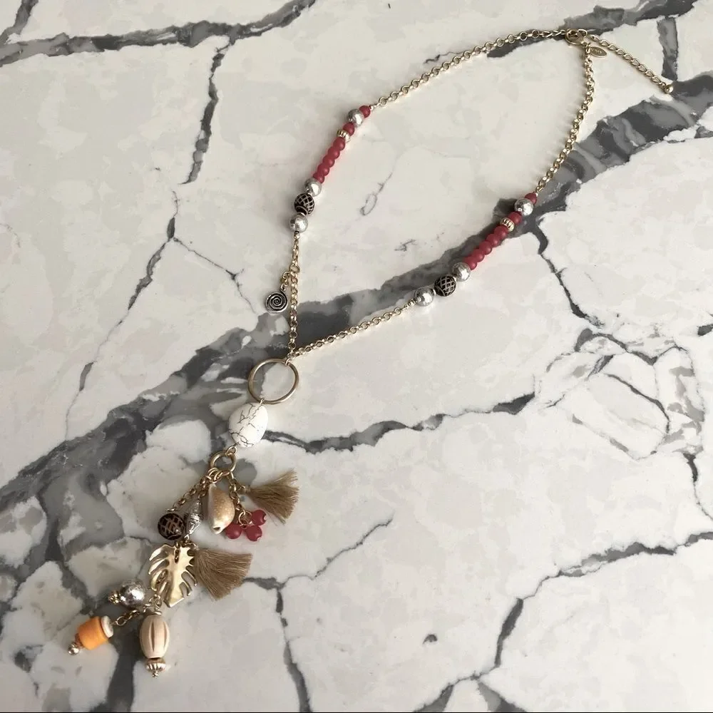 Chico’s long Kira gold tone charm necklace